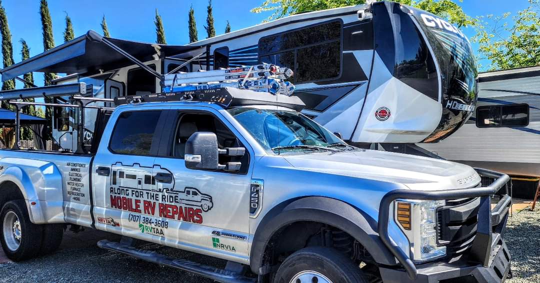 Along For The Ride branded service truck in front of an RV